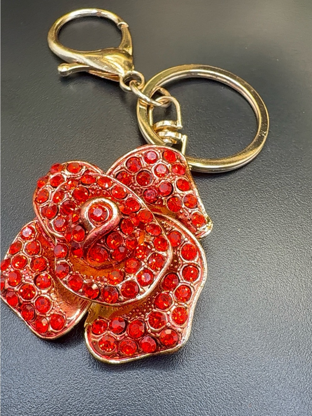 Keychain with red jeweled flower